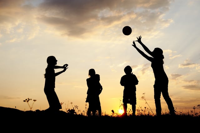 Children playing with ball on meadow, sunset, summertime, sport, volleyball.jpeg